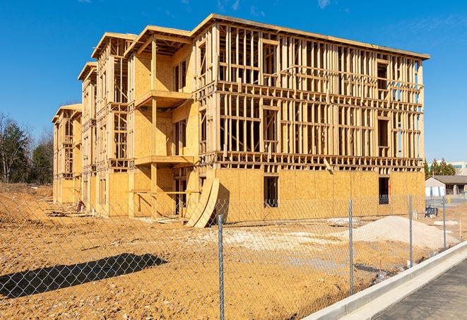 construction zone secured with a temporary fence, marked with warning signs in Montvale VA